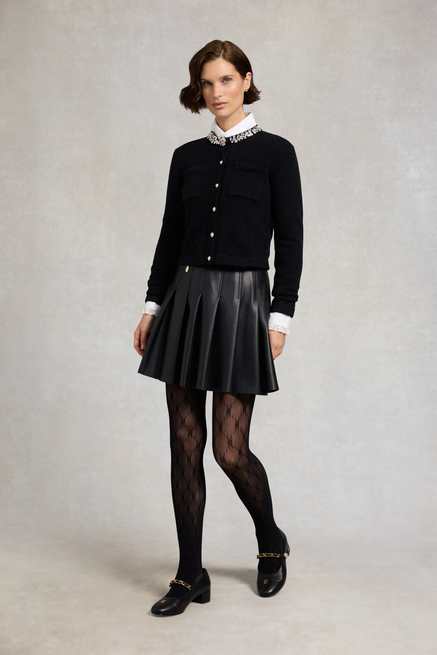 Holland Cooper Faux Leather Pleated Mini Skirt in Black Model Front