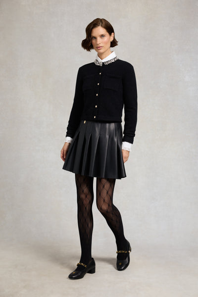 Holland Cooper Faux Leather Pleated Mini Skirt in Black Model Front