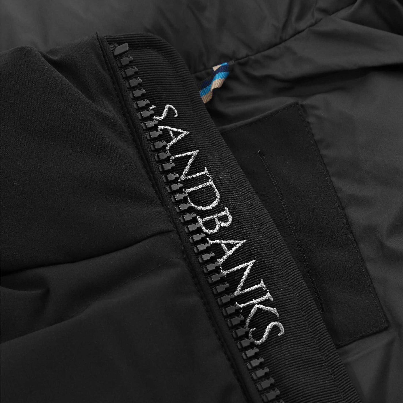 Sandbanks Explorer Gilet in Black Placket Logo