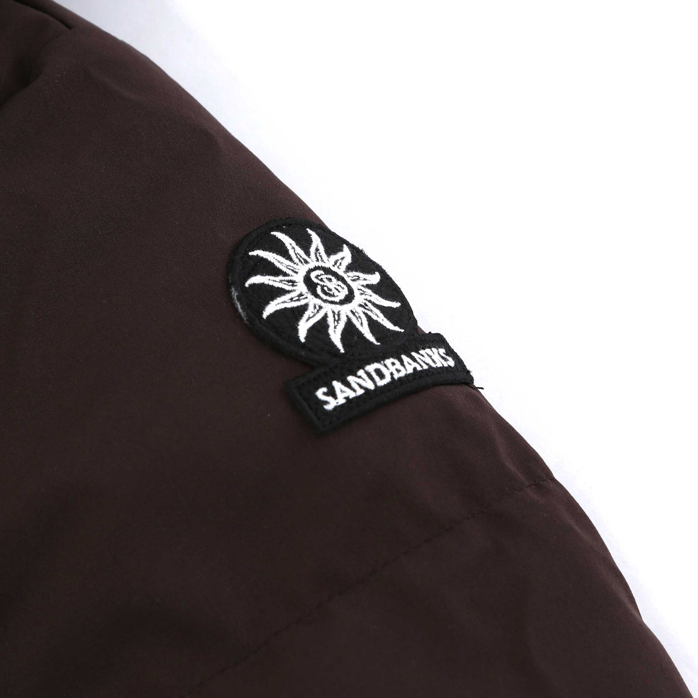 Sandbanks Haven Oversized Long Puffer Ladies Jacket in Brown Logo